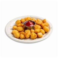 Cheese Curds · Cheddar cheese, deep-fried golden brown for a warm buttery crunch.