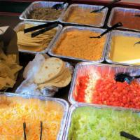 Taco Fiesta 5 (Serves 5 People) · All party packs include fresh salsa, cheese sauce,
chips, homemade flour tortillas, rice, an...