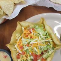 Taco Salad · A crispy flour tortilla shell, generously filled with your choice of meat, beans and rice. T...