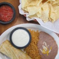 Chimichanga Dinner · A freshly made flour tortilla, generously filled with your choice of meat, cheddar and jack ...