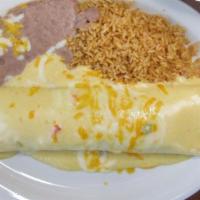 Burrito Dinner · A large 12-inch flour tortilla generously filled with your choice of meat, then topped with ...