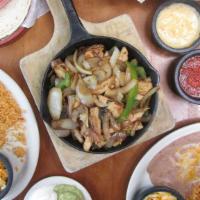 Double Order Of  Fajitas · Our slow marinated fajita meat is served in a warm skillet with caramelized onions and bell ...