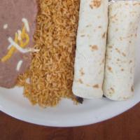 Chicken Tacos Carbon · Our slow marinated fajita meat, diced and rolled in two flour tortillas. Served with a side ...