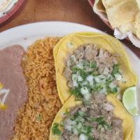 Pork Street Tacos · Slow-simmered pork roast served on four open-faced warm yellow corn tortillas topped with fr...