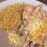 Pollo Ranchero · A slow marinated chicken breast sliced and sauteed with diced onions and fresh cilantro. Smo...