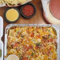 Sheet Pan Nachos Bean & Cheese · New Item!! A generous portion of our nacho chips smothered in a melted blend of cheddar and ...