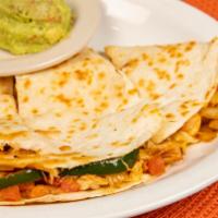 Ted’S Favorite Dilla · A large 12-inch flour tortilla, generously filled with our slow marinated fajita meat, diced...