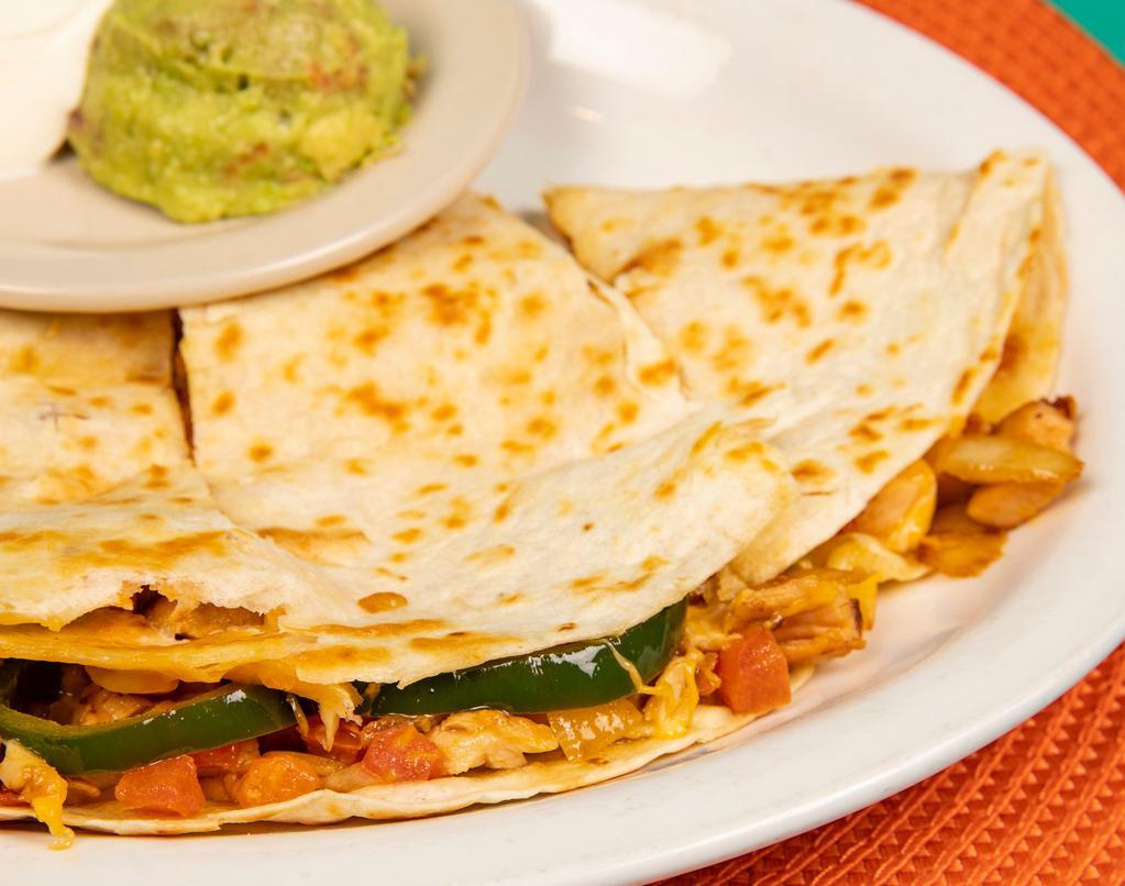 Ted’S Favorite Dilla · A large 12-inch flour tortilla, generously filled with our slow marinated fajita meat, diced and sauteed in butter with our house-made pico de gallo, roasted poblano pepper strips and a blend of cheeses. Served with sour cream and a side of our always-fresh guacamole.