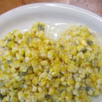 Corn Con Crema · Corn in a creamy sauce with a blend of spices and finely diced green chilies.