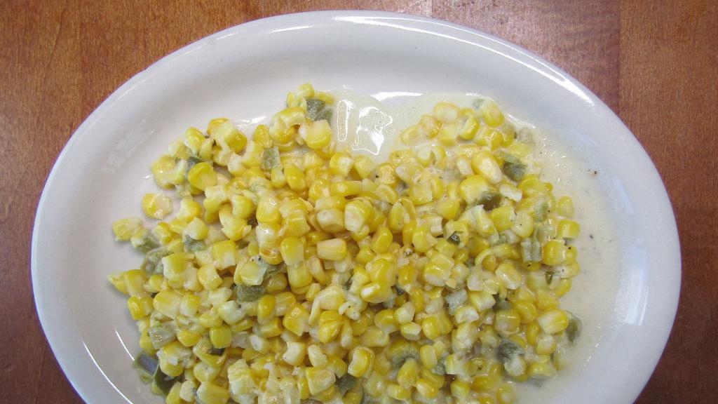 Corn Con Crema · Corn in a creamy sauce with a blend of spices and finely diced green chilies.