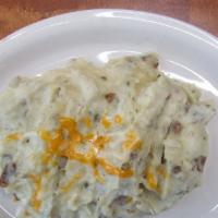 Pappas Mexicanos · House-mashed, garlic infused potatoes with finely diced green chilies, a ted’s favorite.