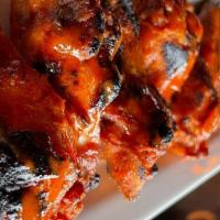 Chicken Wings · char-grilled dry rub seasoned, sweet Thai chili, buffalo or bourbon BBQ.