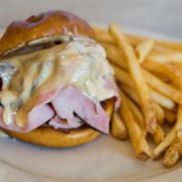 Pretzel Hot Ham & Cheese Sandwich · Black forest ham and swiss cheese served on a pretzel bun and topped with our signature home...
