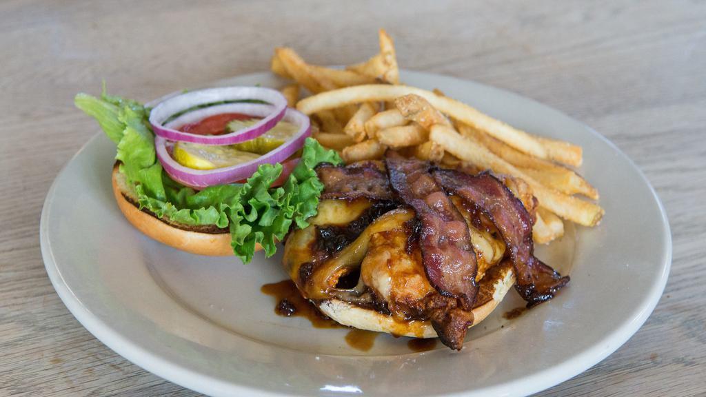 Dunkel Bourbon Chicken Sandwich · Bier battered chicken breast with our homemade dunkel bourbon glaze, provolone cheese, smoked bacon, and our sweet mayonnaise, served with leaf lettuce, tomato, red onion, and pickles on a brioche bun.