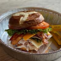 Pretzel Club · Black forest ham, smoked turkey, swiss and thick cut cheddar cheeses, bacon, mayonnaise, let...