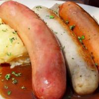 Wurstplatte · Grilled Bierwurst, Bratwurst, and Mettwurst: Our sampler of wursts served with mashed potato...