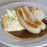 Bratwurst Dinner · Two grilled bratwursts: pork sausages served with mashed potatoes and imported sauerkraut.