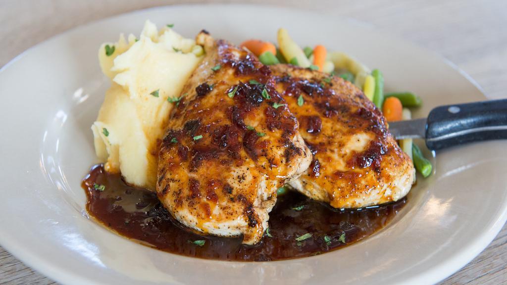 Dunkel Bourbon Chicken · Grilled chicken breasts topped with homemade dunkel bourbon glaze. Served with mashed potatoes and chef's vegetable selection.
