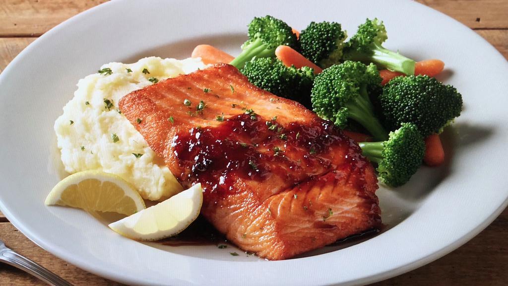 Dunkel Bourbon Salmon · Pan seared Atlantic salmon fillet topped with our homemade dunkel bourbon glaze. Served with mashed potatoes and chef's vegetable selection.