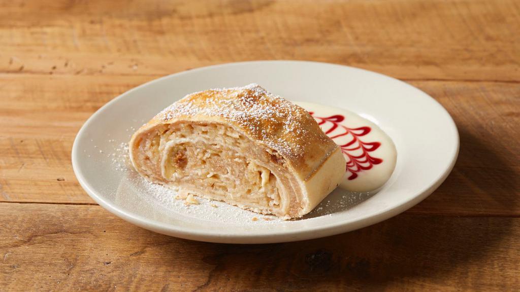 Apfel Strudel · Traditional German apple strudel. Imported from Bavaria and served warm with vanilla and raspberry sauces.