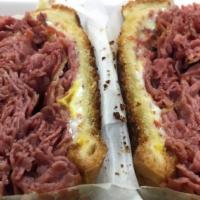 Corned Beef Sandwich · Served on onion roll or rye with mustard and pickle.
