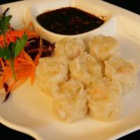 Shrimp Dumplings (5 Pieces) · Steamed shrimp dumplings served with a sweet brown sauce.
