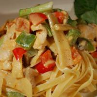 Linguini Curry · Hot and spicy. Coconut red curry stewed with bamboo shoots, onions, mushrooms, baby corn, an...