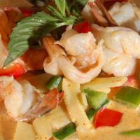 Yellow Curry · Hot and spicy. Traditional thai yellow curry simmered in coconut milk with bell peppers, pot...