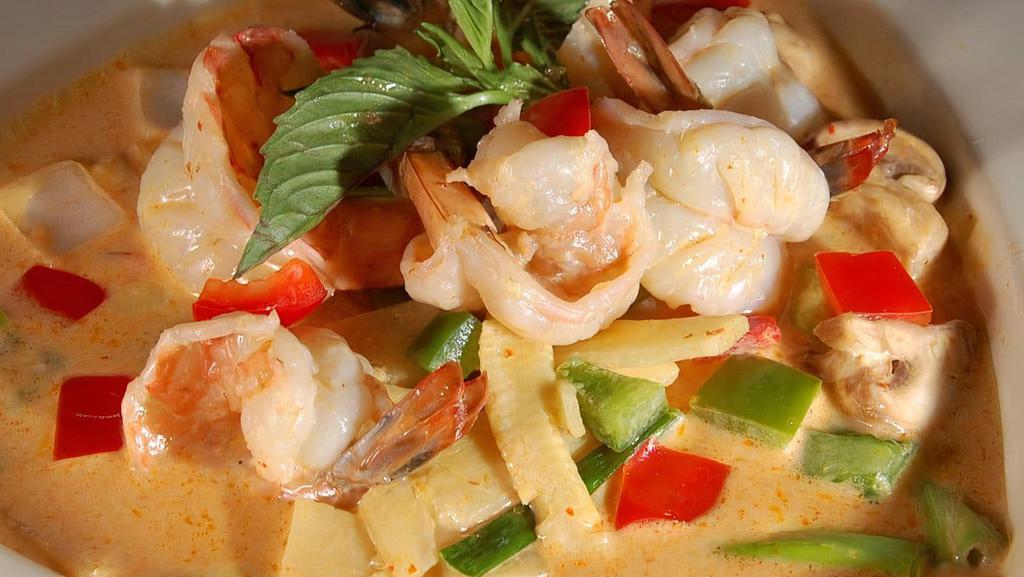 Yellow Curry · Hot and spicy. Traditional thai yellow curry simmered in coconut milk with bell peppers, potatoes and onions.