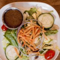 House Salad · mixed field greens with tomatoes, carrots, red onions, and sliced cucumber.