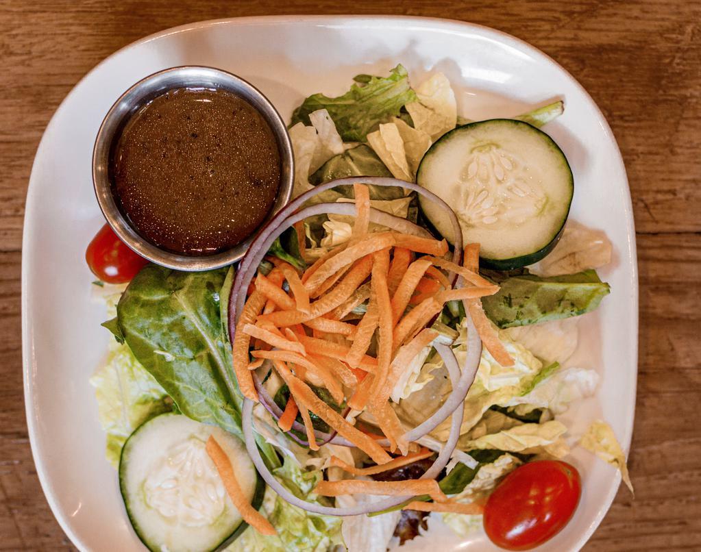 House Salad · mixed field greens with tomatoes, carrots, red onions, and sliced cucumber.