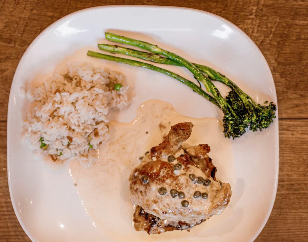 Chicken Or Veal Piccata · breaded and pan-seared, topped with a creamy caper, lemon, and butter sauce. Served atop rice pilaf with our vegetable of the day.