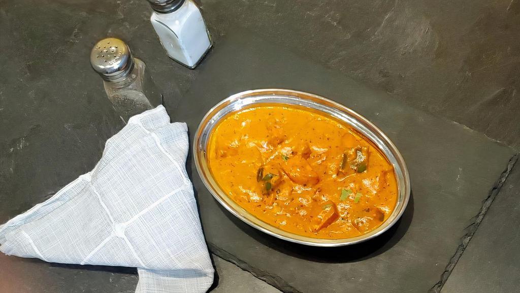 Paneer Butter Masala · Vegetarian delight cottage cheese cooked in cream and tomato gravy.