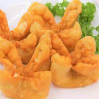 Crab Rangoon Wontons · Crispy, imitation crab & cream cheese-filled appetizers (or even desserts) served with sweet...