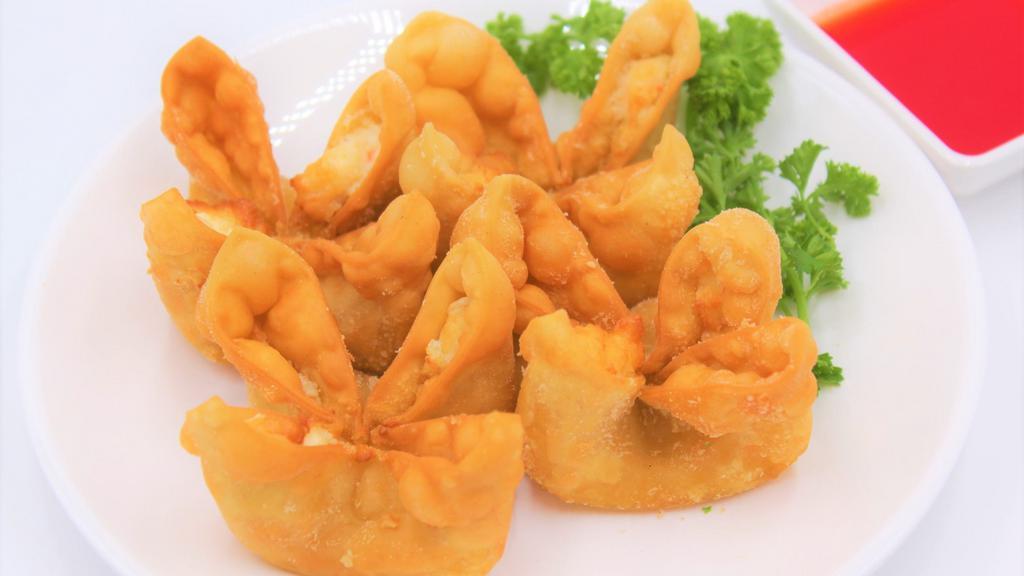 Crab Rangoon Wontons · Crispy, imitation crab & cream cheese-filled appetizers (or even desserts) served with sweet & sour sauce.