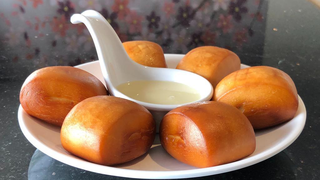 Fried Mantou · Fried, fluffy steamed buns served with condensed milk.