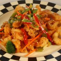 Gluten Free Hot & Sour Calamari · Tossed with red peppers, snap peas, carrots, broccoli, scallions, and sesame seeds.