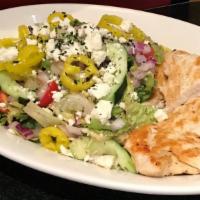 Roasted Chicken Greek Salad · Feta cheese, grape tomatoes, cucumbers, red onions, Kalamata olives, pepperoncini, and a bal...