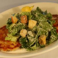 Chicken Milanese Caesar · Crispy chicken served with our classic caesar, parmesan cheese, and garlic croutons.