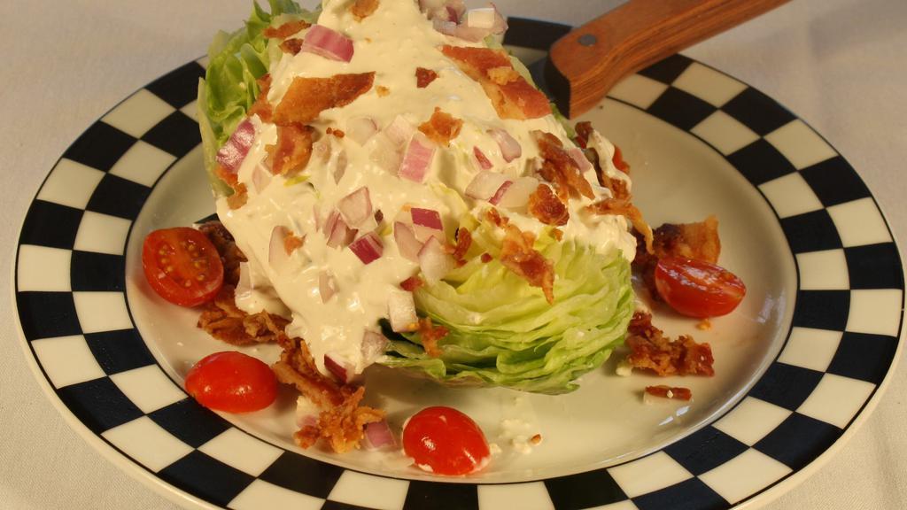Gluten Free Wedge Of Iceberg · Crisp bacon, grape tomatoes, red onion, and choice of dressing.