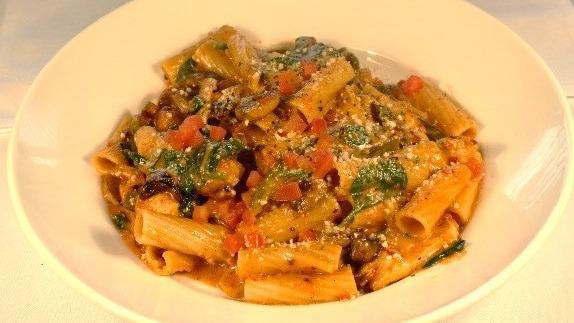 Spicy Chicken Rigatoni · Mushrooms, tomatoes, spinach, poblano peppers, and roasted red pepper cream sauce.