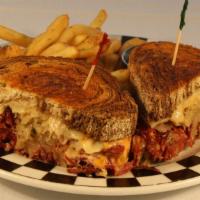 Jake’S Famous Reuben · House made pulled corned beef, Swiss cheese, sauerkraut, and 1000 island on marble rye.