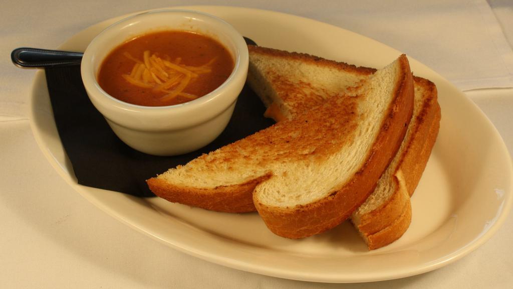 Kid'S Grilled Cheese & Tomato Soup · American on country white bread served with a cup of creole tomato soup.