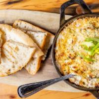 Hot Crab & Artichoke Dip · Pint. Gruyere, Parmesan, grilled bread.