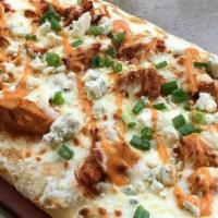 Tuscan Style Buffalo Chicken Pizza · Zesty ranch, spicy buffalo chicken, blue cheese crumbles garnished with fresh scallions and ...