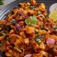 Kothu Paratha Chicken · Prepared with shredded parotta that is tossed in a sautéed onion-tomato spiced mixture, scra...