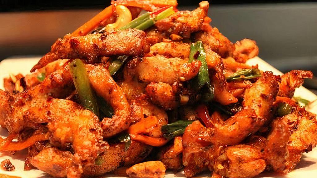 Dragon Chicken · Chicken strips marinated, fried and sauteed in a spicy and tangy sauce.