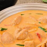 Thai Red Curry · A Thai favorite for the ages cooked in coconut milk, spices with Mama's twist