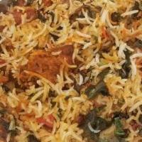 Triveni Chicken Biryani · Boneless, Full of flavor where Chicken is fused with Basmati rice and spices