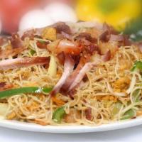 Singapore Nooldes · An Indo-Chinese combination mixing the curry powder and noodle traditions of two oldest civi...